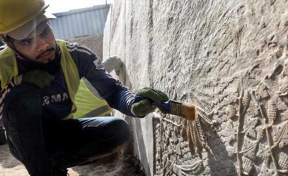 Assyrian reliefs unveiled in ruins left by Isis in Iraq