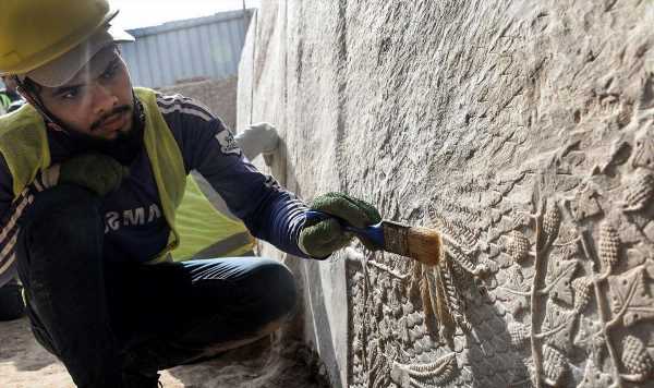 Assyrian reliefs unveiled in ruins left by Isis in Iraq