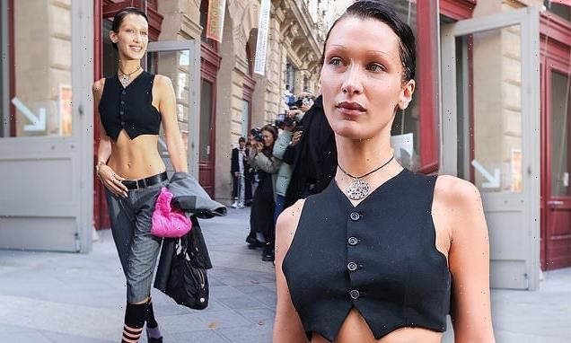 Bella Hadid shows off her toned physique in a cropped waist coat