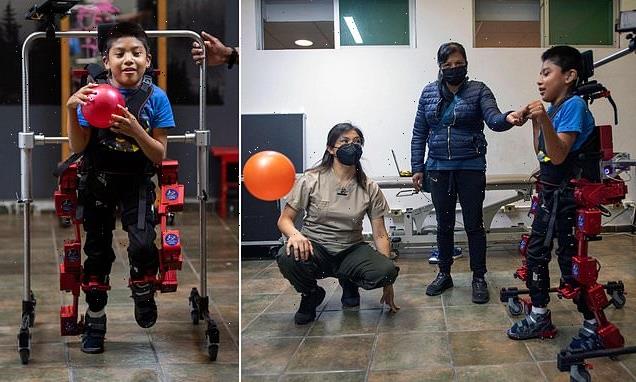 Boy, 8, with cerebral palsy takes his first steps in an exoskeleton