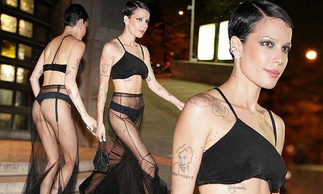 Halsey flashes a glimpse of her bottom in a sheer skirt during PFW