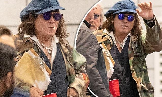 Johnny Depp continues holding onto his red solo cup in Toronto