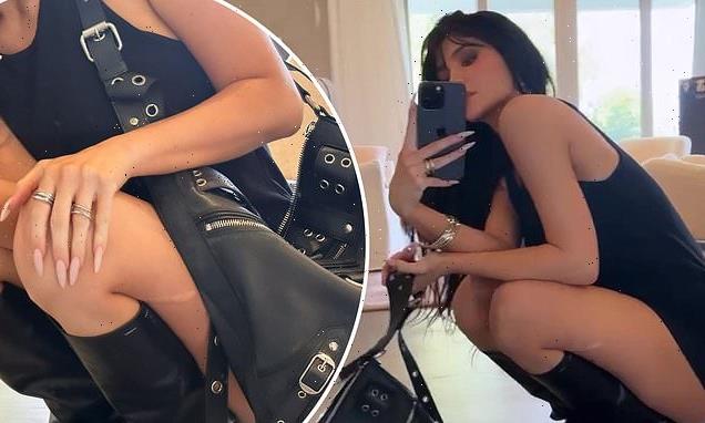 Kylie Jenner is a modern femme fatale in a skintight LBD and boots