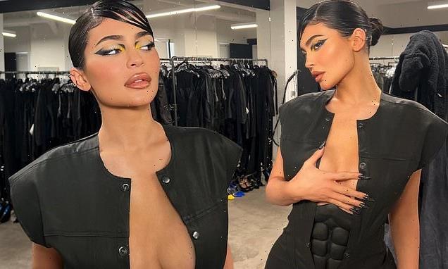 Kylie Jenner shows off her sexy figure in a plunging Batman costume