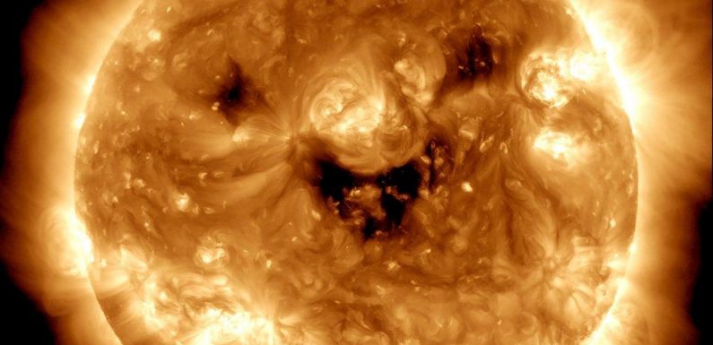 NASA warns happy image of smiling sun could be sign of upcoming solar storm