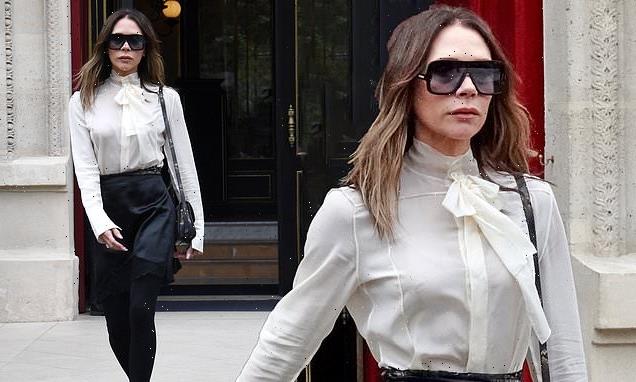Victoria Beckham exits hotel after defiant family display at her show