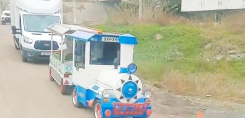 Fleeing Russians hitch ride on kid’s fairground train as they run from Kherson