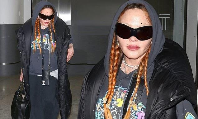 Madonna layers up in style as she jets into NYC