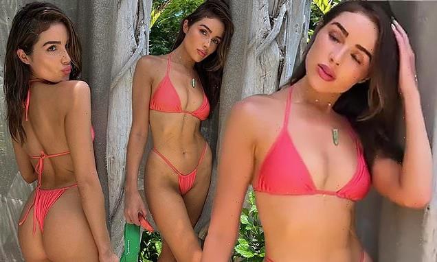 Olivia Culpo displays her enviable figure in a pink string bikini
