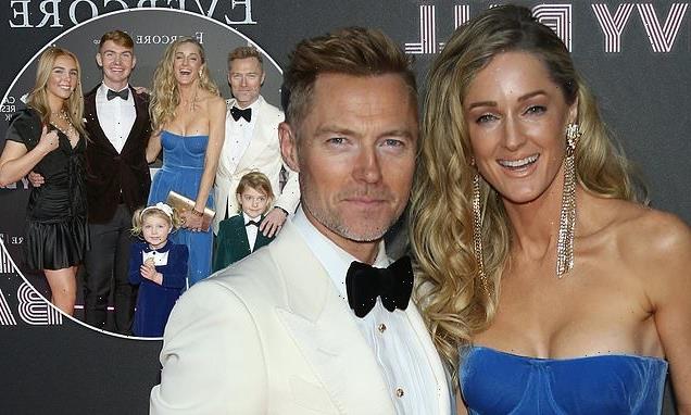 Ronan Keating and wife Storm pose with their children at ball