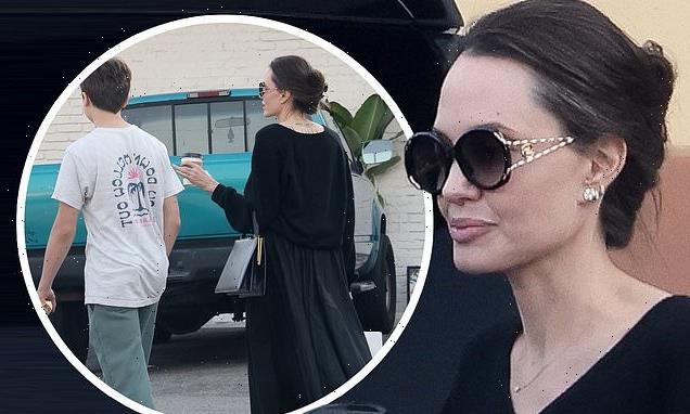 Angelina drapes lithe frame in flowing black dress while out with Knox