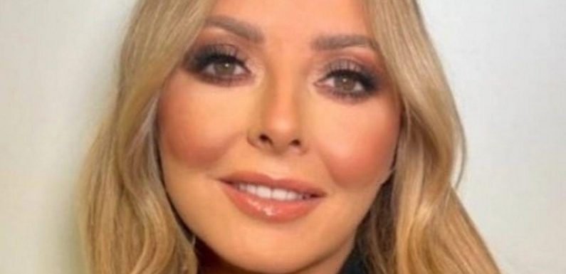 Carol Vorderman parades killer curves as she writhes around in cheeky dance clip