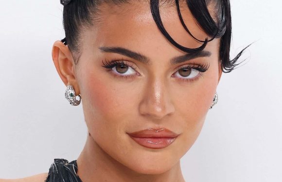 Kardashian fans go wild as Kylie Jenner goes braless in blue mini dress for Paris fashion show in new video | The Sun