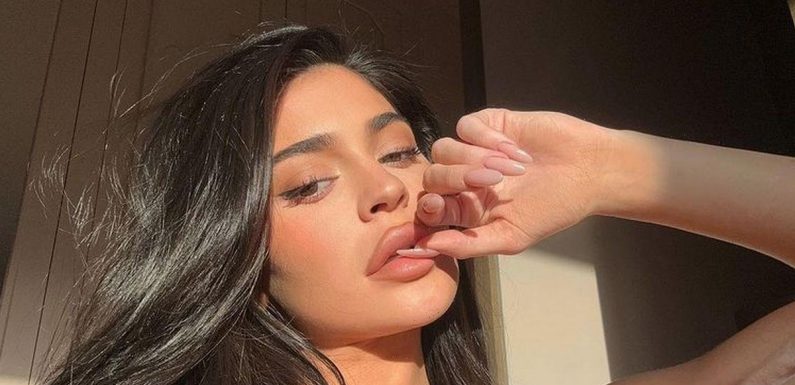 Kylie Jenner turns up the heat as she squeezes iconic curves into plunging bra
