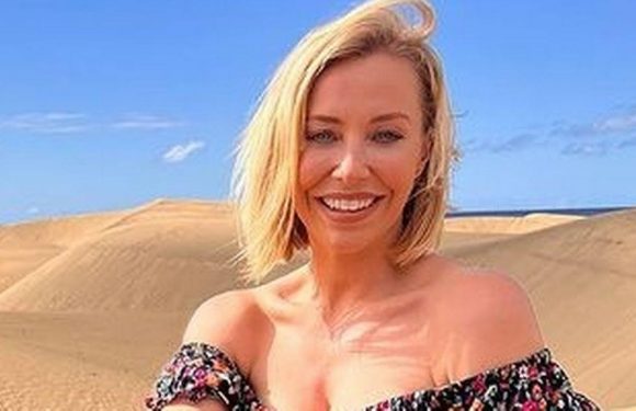 A Place In The Sun’s Laura Hamilton sizzles as she lounges on sand in minidress