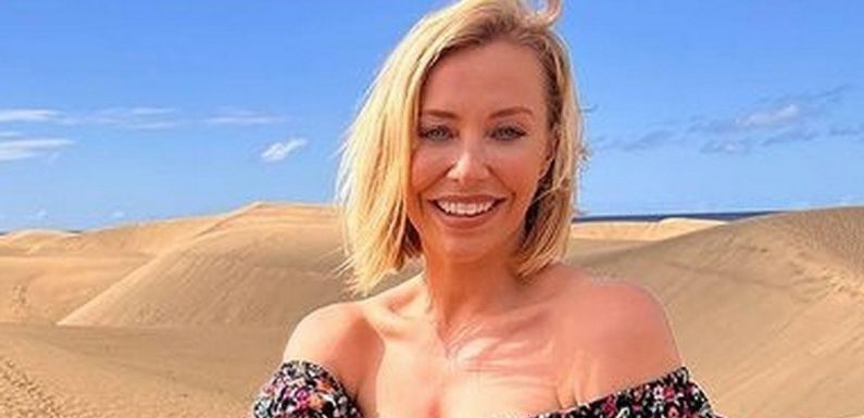 A Place In The Sun’s Laura Hamilton sizzles as she lounges on sand in minidress