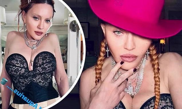 Madonna poses in low-cut corset  in latest collection of daring photos