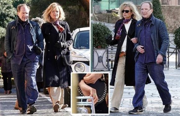 Ralph Fiennes is snapped linking arms with a mystery blonde in Rome