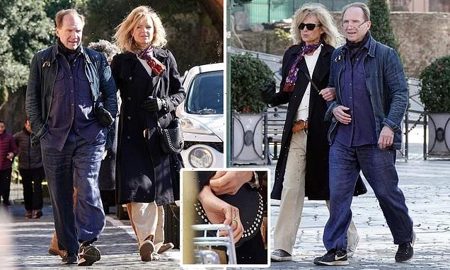 Ralph Fiennes is snapped linking arms with a mystery blonde in Rome