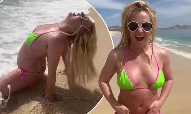 Britney Spears slips into a TINY neon bikini as she hits the beach