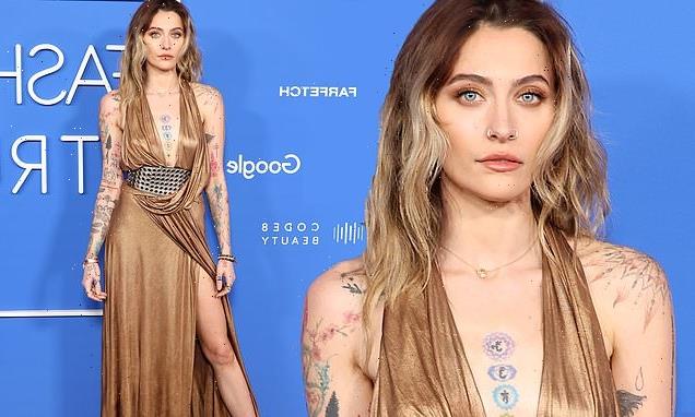Paris Jackson dons a plunging gold dress at Fashion Trust US Awards