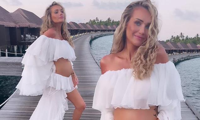 Pregnant Laura Anderson displays her growing bump during Maldives trip