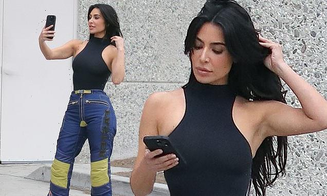 Kim Kardashian shows off famous curves while on the phone in Calabasas