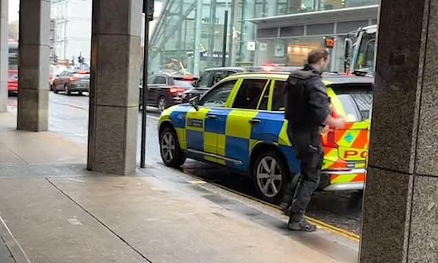 Moment police walk out of McDonald's having parked on a double yellow