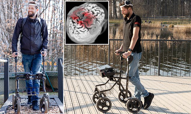 Paralysed man walks for the first time in 12 YEARS thanks to implant