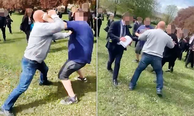 Shocking moment pair of FATHERS brawl on school playing fields