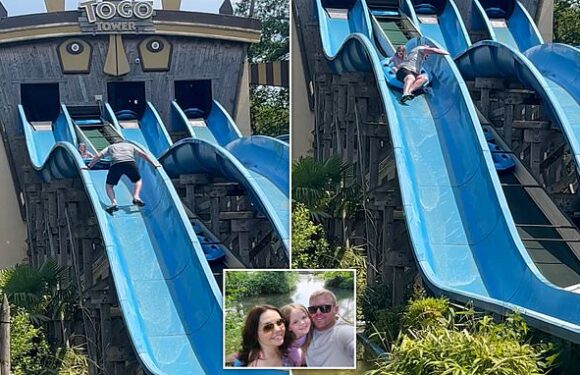 Father climbs up waterslide to rescue his terrified daughter