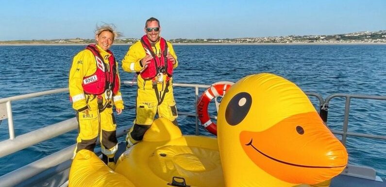 Giant duck sparks rescue emergency as three men drift out to sea on inflatable