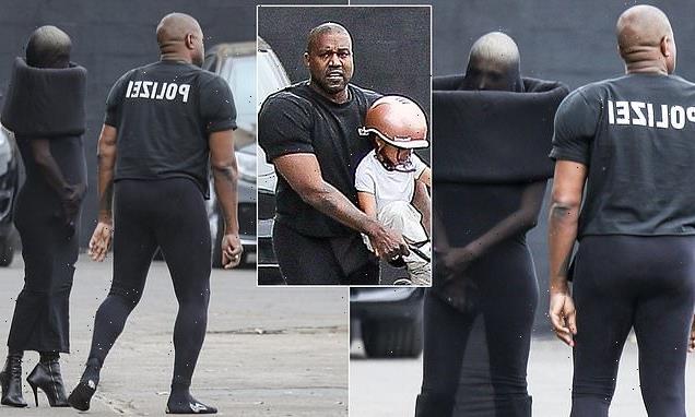 Kanye West plays with son Psalm while 'wife' Bianca dons bizarre dress