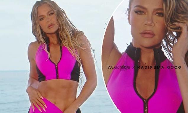 Khloe Kardashian shows off her taut midriff in a plunging scuba top