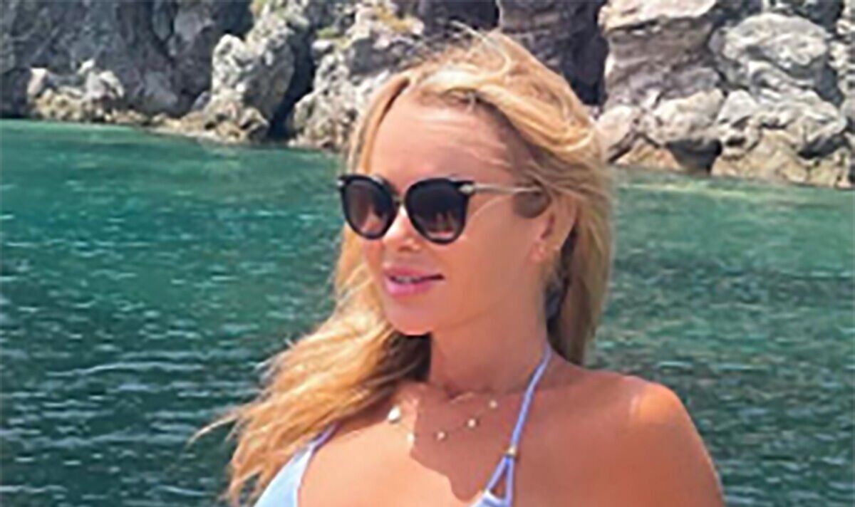Amanda Holden gives ‘Bond girl vibes’ as she sunbathes in tiny blue bikini