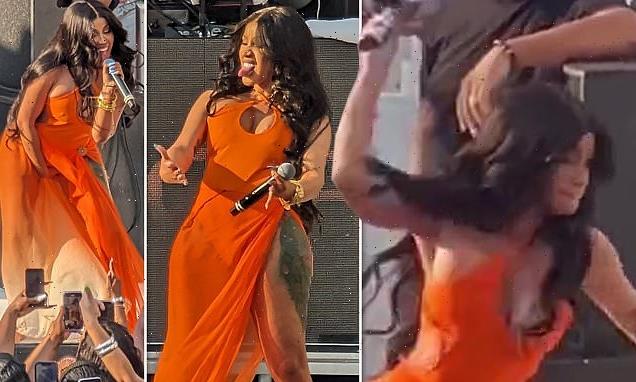 Cardi B hurls a microphone at fan who threw a drink at her