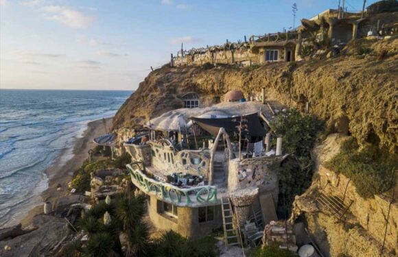 I was homeless so I carved myself a CAVE house with incredible sea views – but officials are trying to kick me out | The Sun