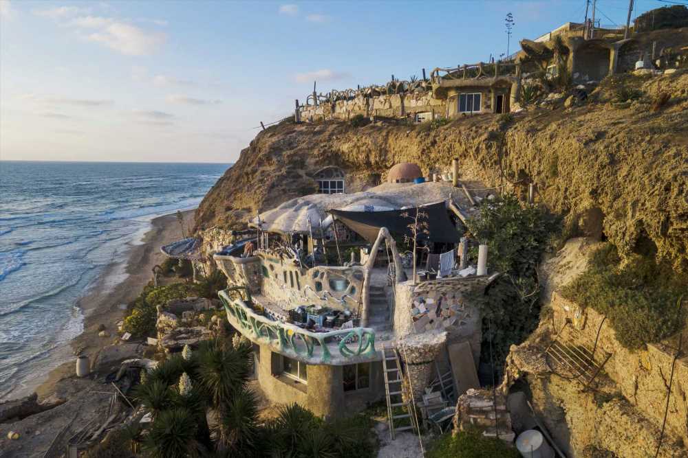 I was homeless so I carved myself a CAVE house with incredible sea views – but officials are trying to kick me out | The Sun
