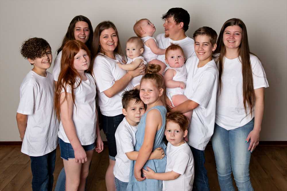 I’m a mum-of-12 at 32 & work supermarket shifts to support them – trolls constantly ask me how many dads they have | The Sun