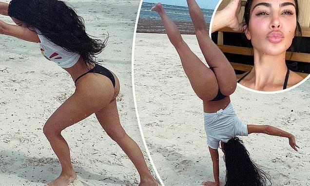 Kim Kardashian wows in thong bikini as she does cartwheels