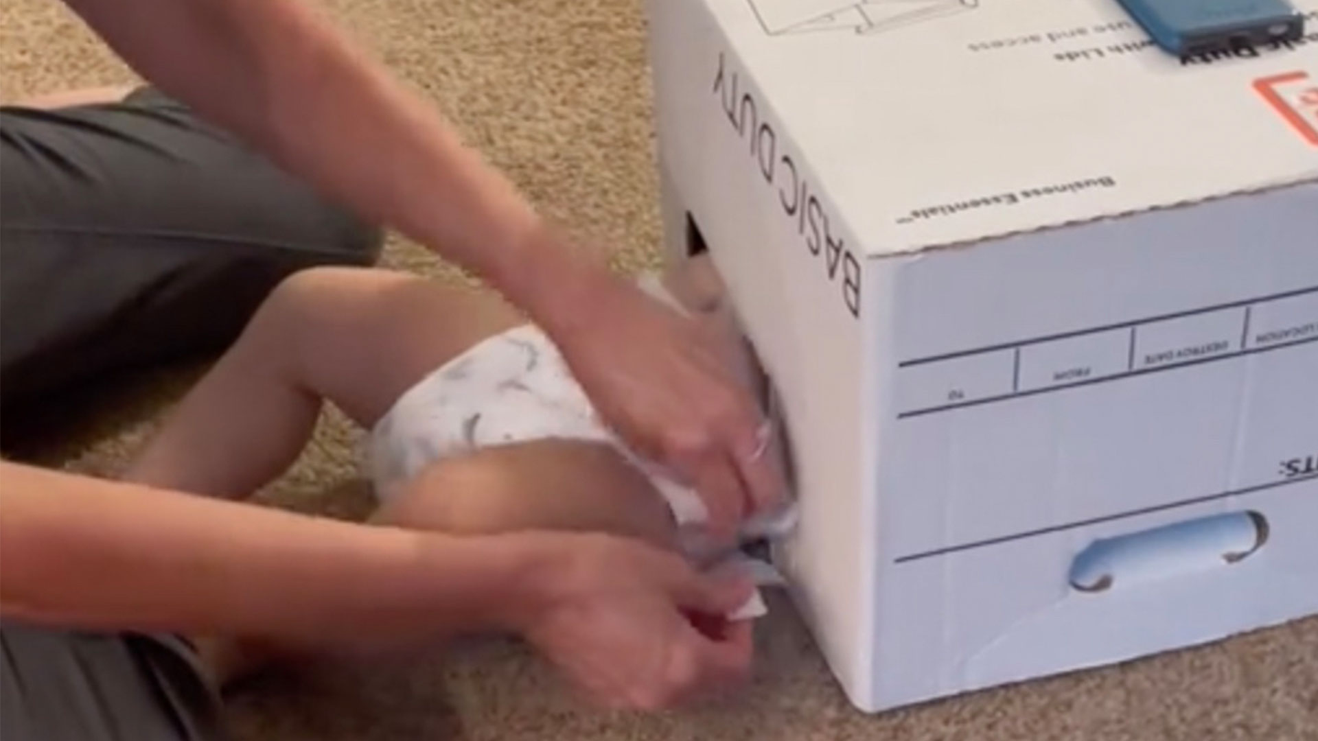 Mum praised for sharing 'greatest life hack' ever as she shows how she gets her son to stay still during a nappy change | The Sun