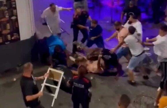 Shocking video shows massive brawl on Spain’s ‘Sin Street’ as drinkers batter each other with chairs & smash bottles | The Sun