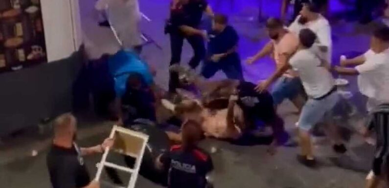 Shocking video shows massive brawl on Spain’s ‘Sin Street’ as drinkers batter each other with chairs & smash bottles | The Sun