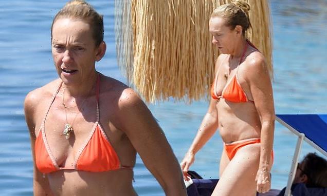 Toni Collette, 50, shows off her abs in a tiny orange bikini