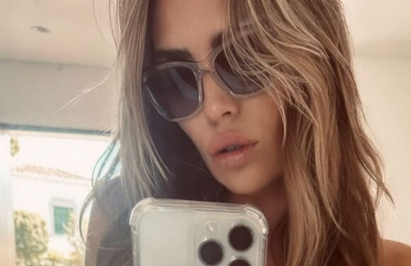 Abbey Clancy showcases washboard abs in tiny bikini in jaw-dropping holiday snap