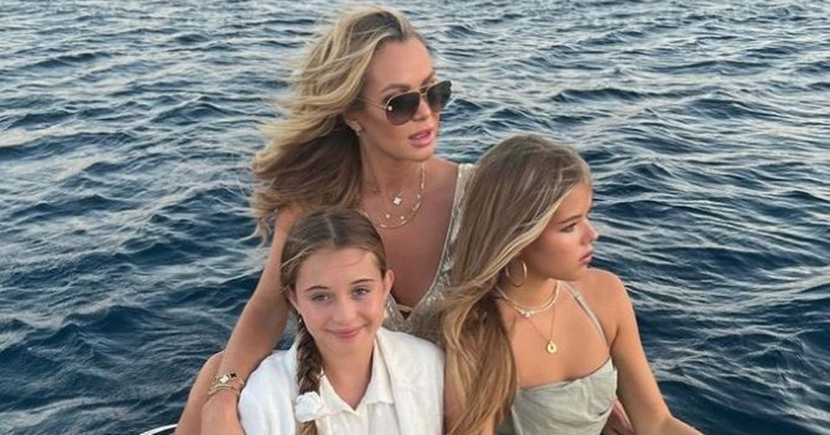 Amanda Holden wows in low-cut dress for sweet holiday snap with daughters