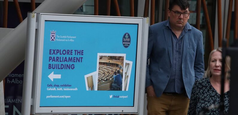 Graham Linehan arrives to perform outside Scottish Parliament