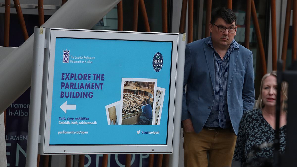 Graham Linehan arrives to perform outside Scottish Parliament