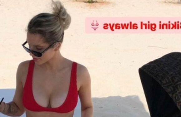 Helen Flanagan puts on a VERY busty display in red bikini in Greece