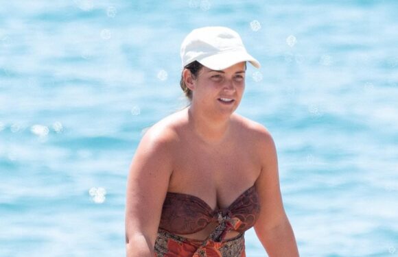 Jacqueline Jossa puts on a cheeky display in a strapless swimsuit